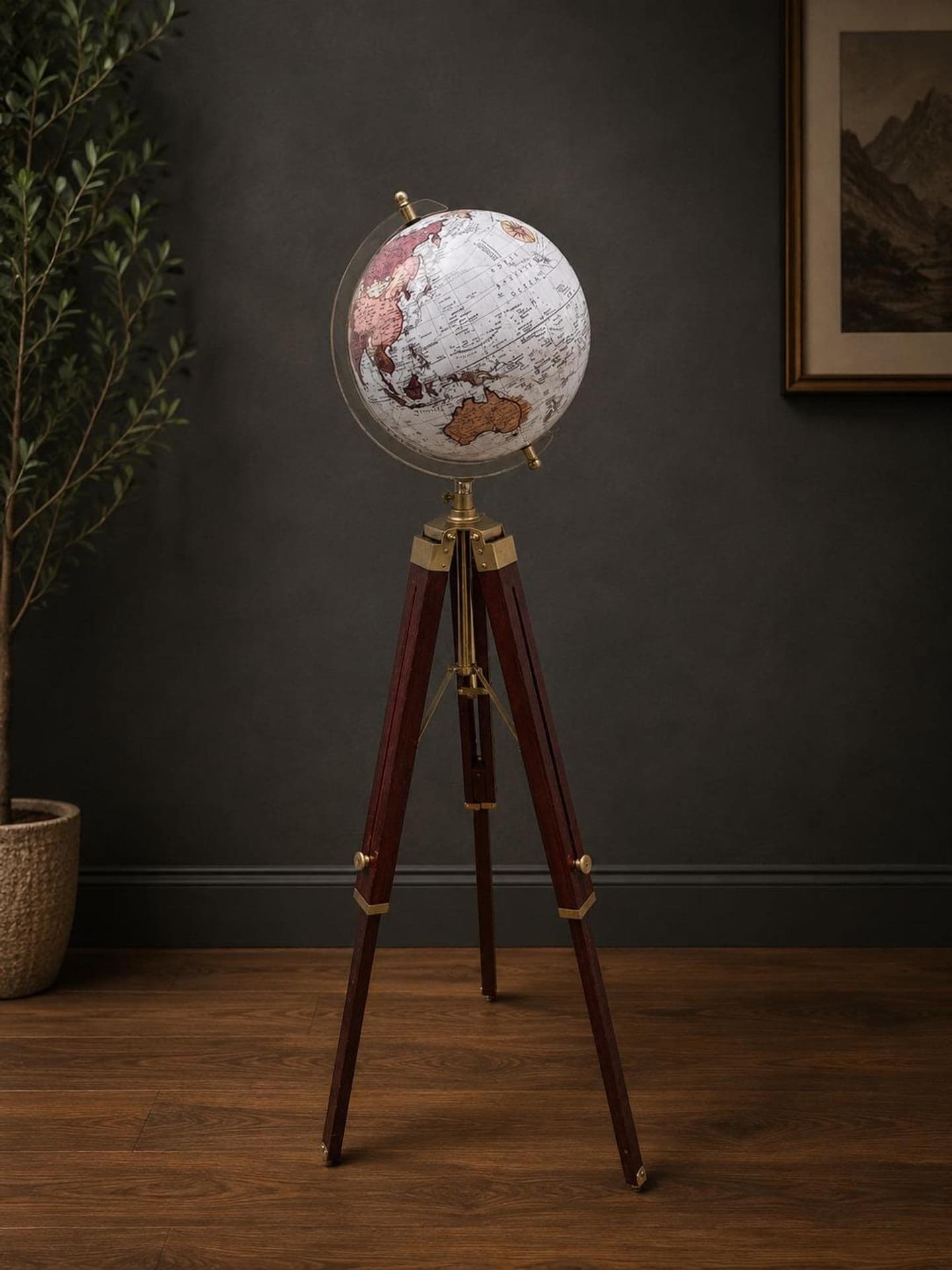 Floor-standing world globe with gold map on black metal tripod — image 1 of 8
